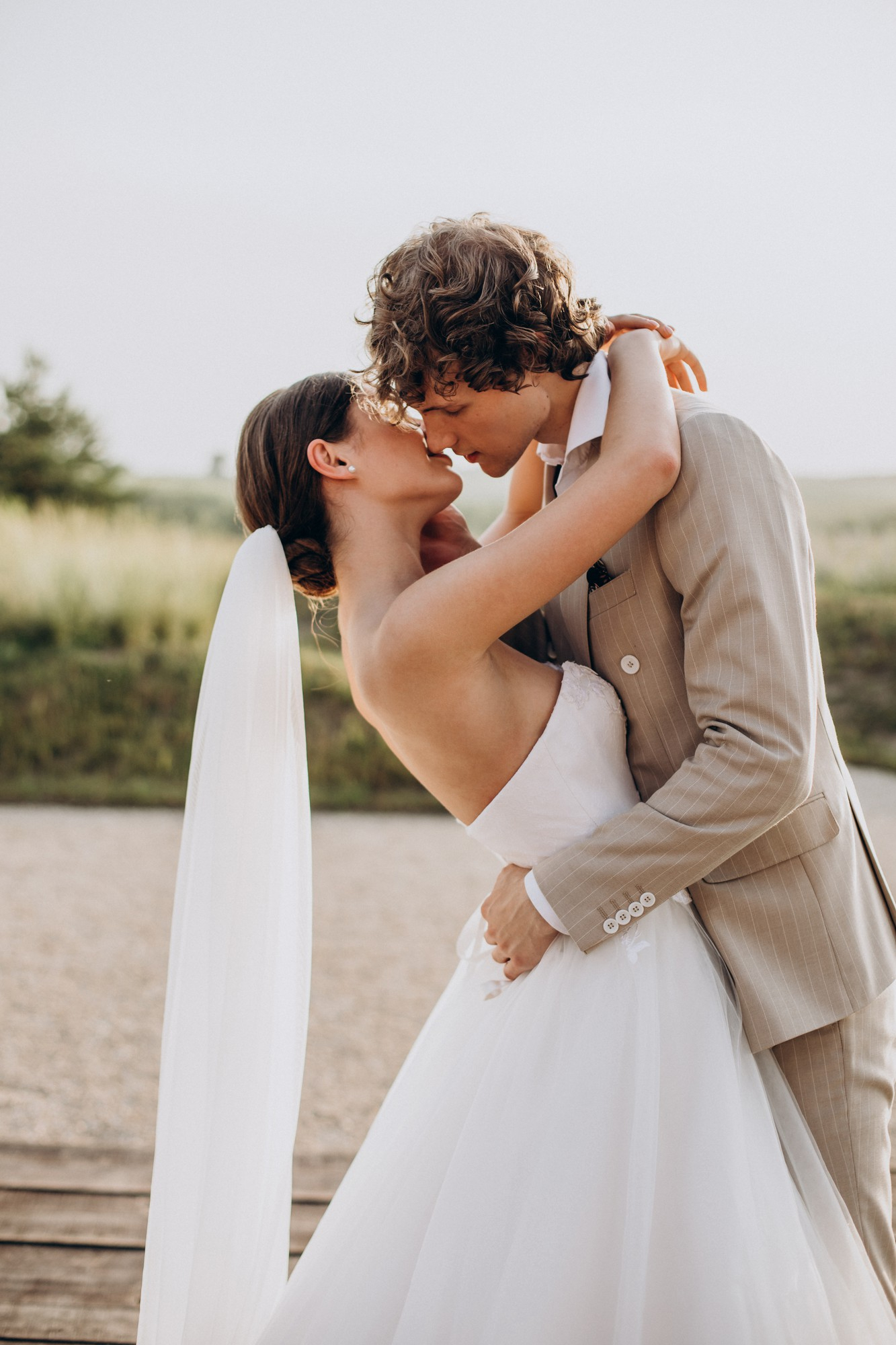Bride and groom kissing at an elegant Italian wedding venue near Milan